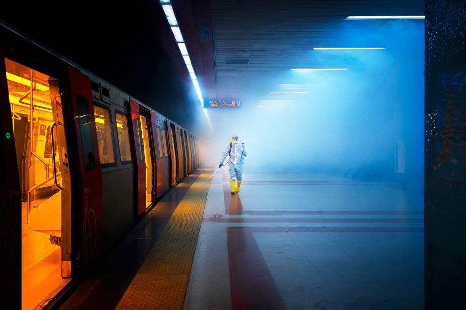 Turkish photographer F. Dilek Uyar won the street photography category with this photo of a worker from the health affairs unit of Ankara Municipality disinfecting a railway platform.