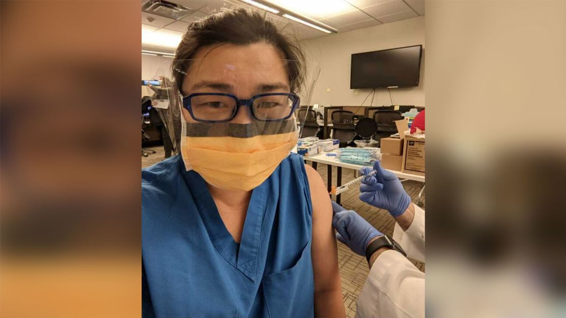 Jae, a cardiologist, getting one of her shots of the Covid-19 vaccine.