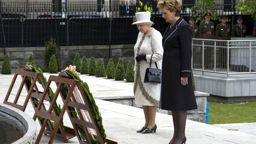 DUBLIN, IRELAND - MAY 17:  Irish President Mary McAleese and Queen Elizabeth II lay a wreath at Dublin Memorial Garden on May 17, 2011 in Dublin, Ireland. The Duke and Queen's visit is the first by a monarch since 1911. An unprecedented security operation is taking place with much of the centre of Dublin turning into a car free zone. Republican dissident groups have made it clear they are intent on disrupting proceedings.  (Photo by Pool/Getty Images)