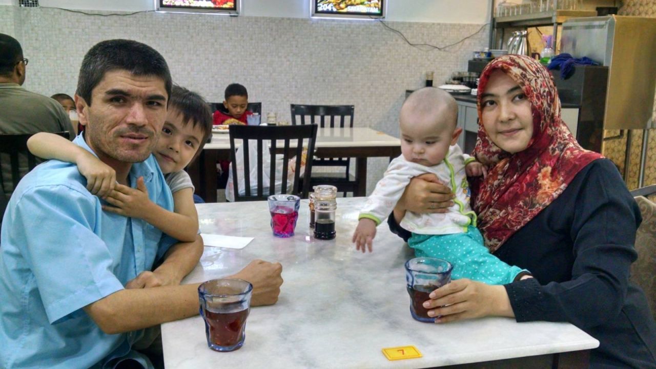 Mamutjan, his daughter Muhlise, his wife Muherrem and their young baby boy in Malaysia in 2015.