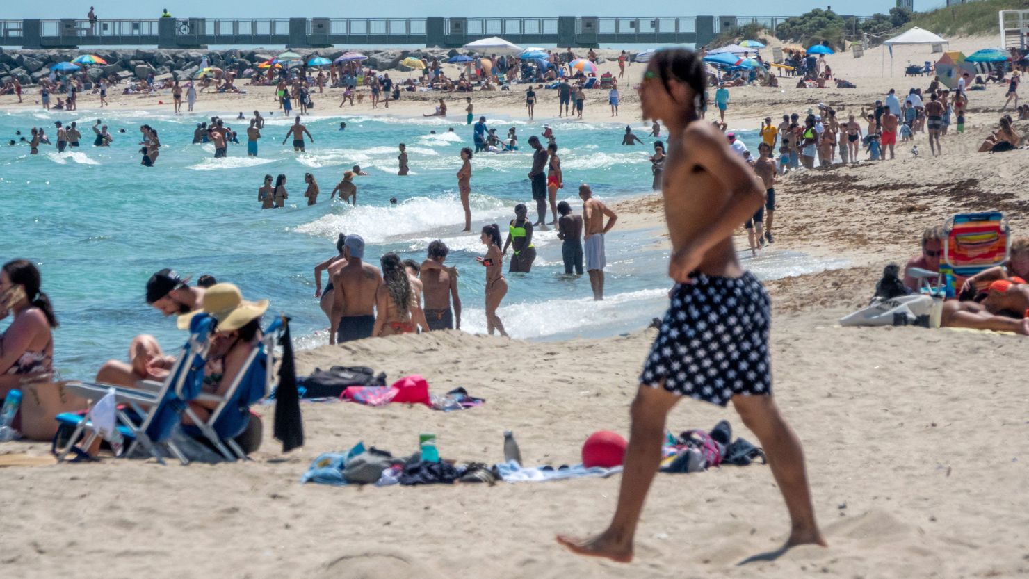 People spend spring break at the beach in Miami Beach, Florida, during the ongoing coronavirus pandemic.