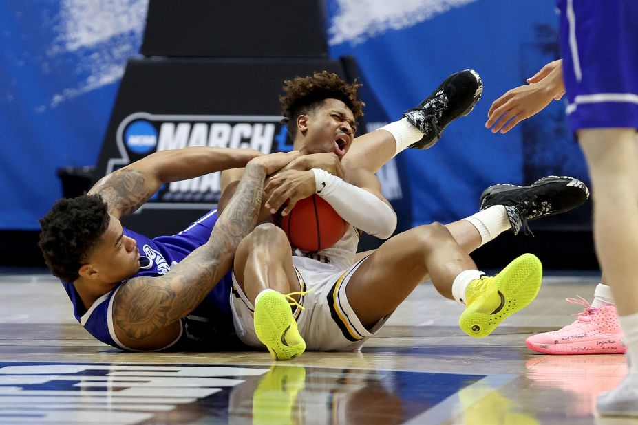 Drake's Darnell Brodie, left, and Wichita State's Tyson Etienne battle for a loose ball during their "First Four" play-in game. Drake won 53-52 for its first NCAA Tournament win in 50 years.