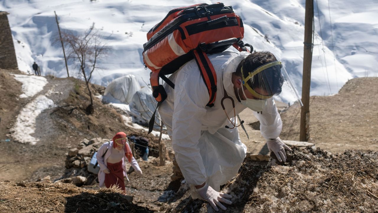 Doctor Akay Kaya, right, and a nurse Yildiz Ayten from the Bahcesaray public hospital, arrive in the remote village of Guneyyamac in eastern Turkey, to vaccinate residents aged 65 or over with the Sinovac CoronaVac Covid-19 vaccine, on February 15, 2021.