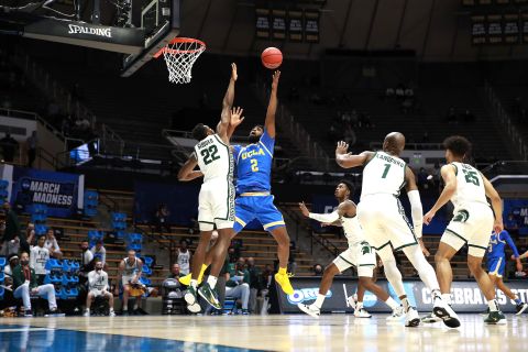 UCLA's Cody Riley shoots the ball over Michigan State's Mady Sissoko.