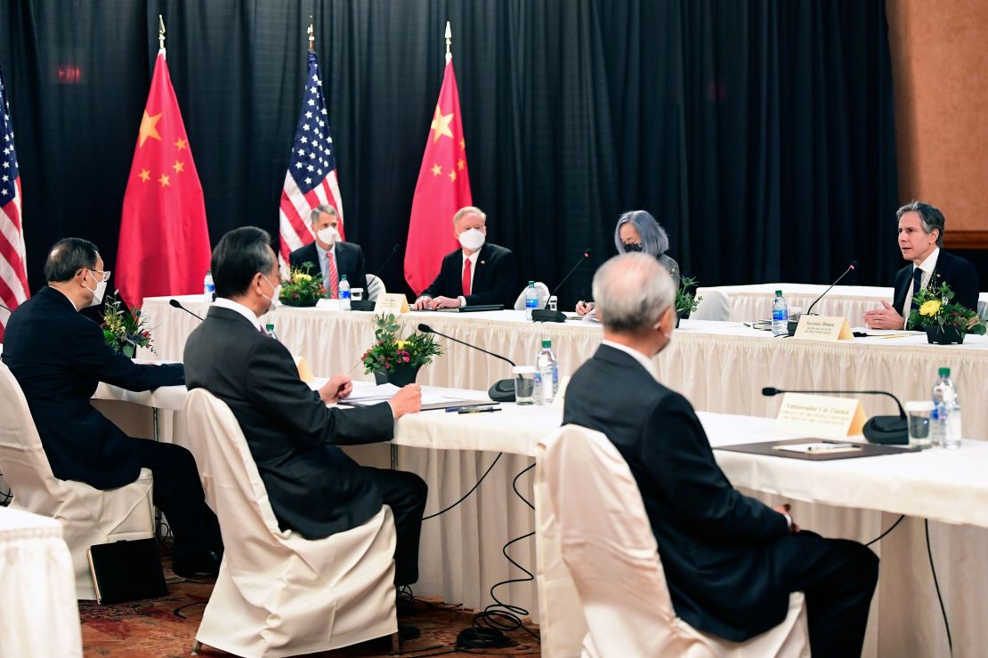 Secretary of State Antony Blinken, speaks as Chinese Communist Party foreign affairs chief Yang Jiechi, left, and China's State Councilor Wang Yi, second from left, listen at the opening session of US-China talks at the Captain Cook Hotel in Anchorage, Alaska, earlier this month.