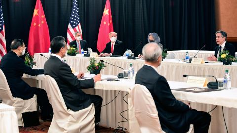Secretary of State Antony Blinken, speaks as Chinese Communist Party foreign affairs chief Yang Jiechi, left, and China's State Councilor Wang Yi, second from left, listen at the opening session of US-China talks at the Captain Cook Hotel in Anchorage, Alaska, earlier this month.