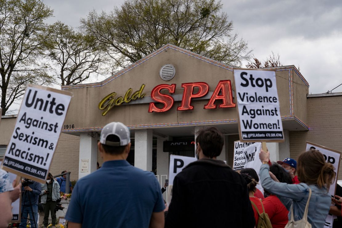 Activists demonstrate outside Gold Spa, the scene of one of the shootings, on March 18, 2021.
