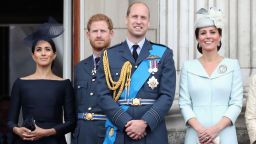 Meghan, Duchess of Sussex, Prince Harry, Duke of Sussex, Prince William, Duke of Cambridge and Catherine, Duchess of Cambridge watch the RAF flypast on the balcony of Buckingham Palace in 2018.