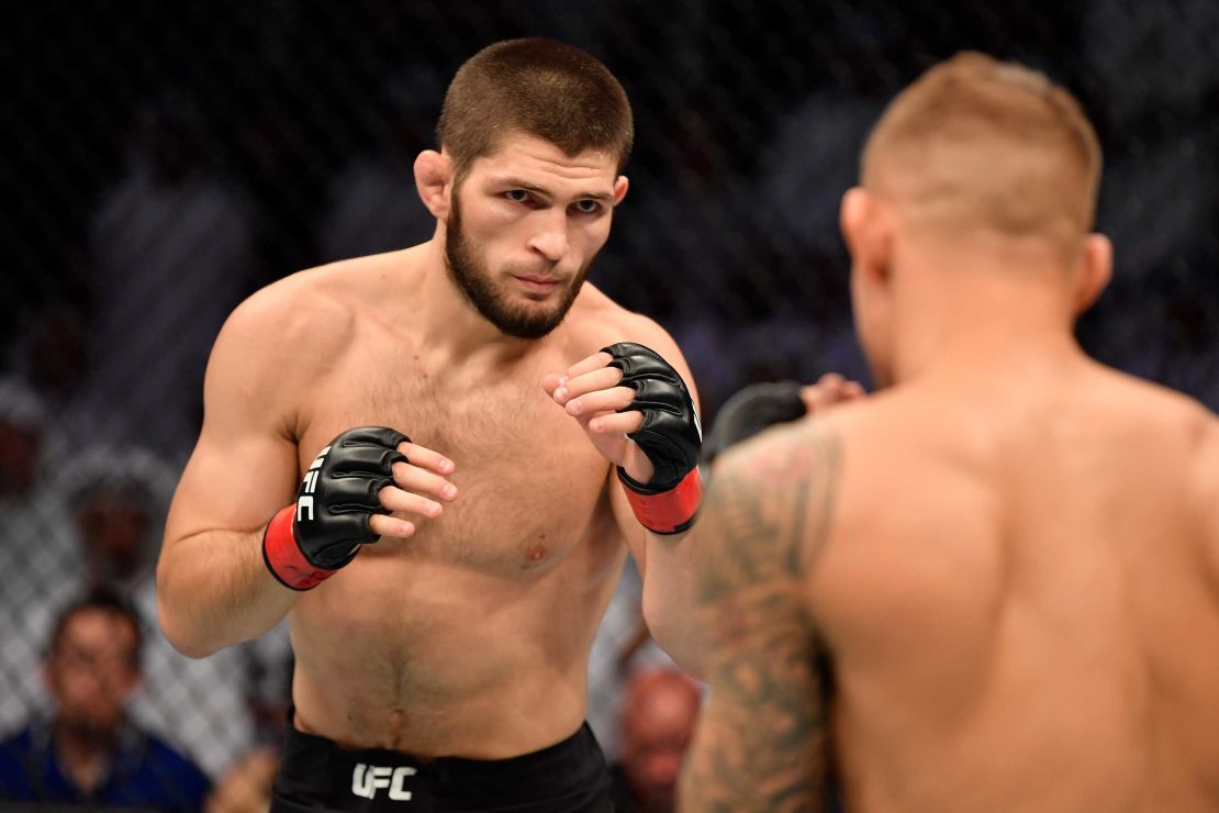 Nurmagomedov battles Dustin Poirier in their lightweight championship bout during UFC 242.