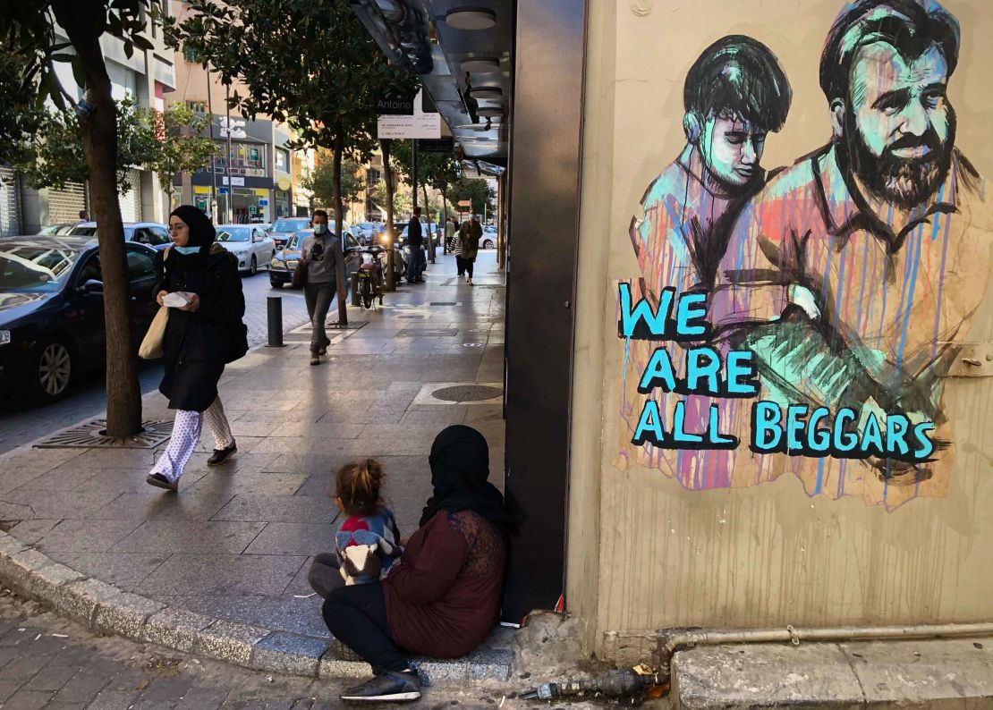 A woman and her daughter begging on Beirut's commercial Hamra Street on March 16. Tuesday, March 16, 2021. More than half the population now lives in poverty.
