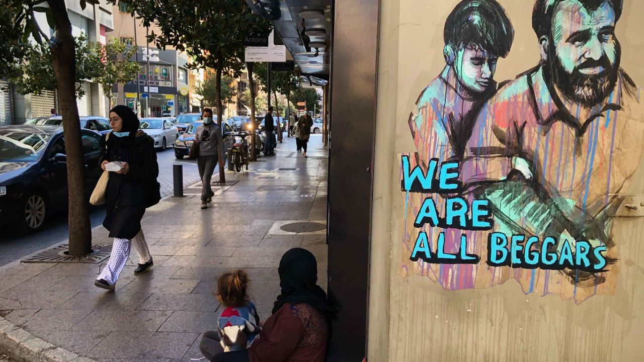 A woman and her daughter begging on Beirut's commercial Hamra Street on March 16. Tuesday, March 16, 2021. More than half the population now lives in poverty.