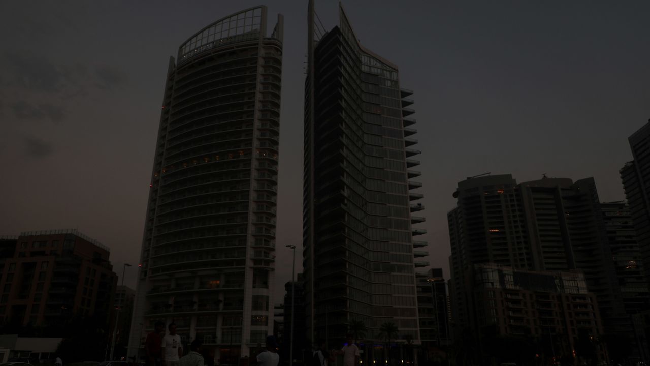 Buildings loom in darkness during a blackout in Beirut on July 5, 2020. 