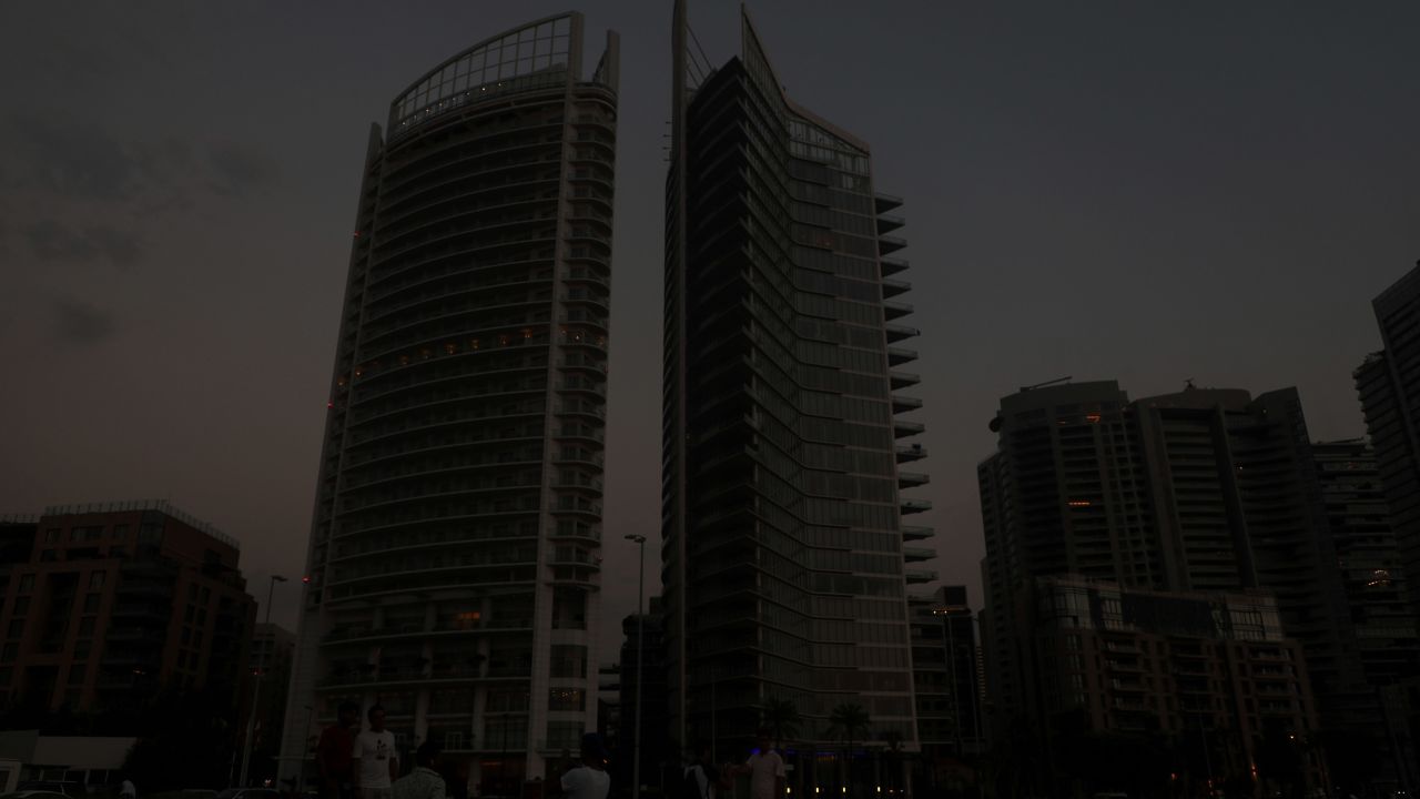 Buildings loom in darkness during a blackout in Beirut on July 5, 2020.