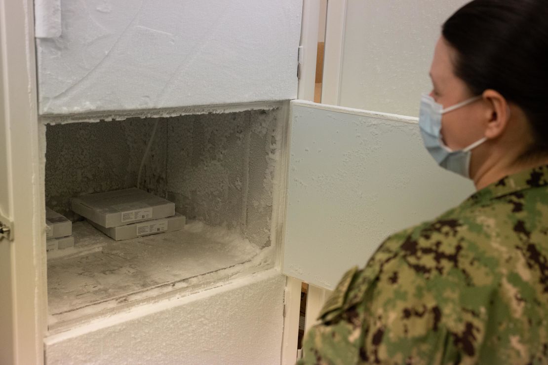 Lt. Jennifer M. White opens the freezer used to store the Pfizer vaccine at Naval Medical Center Portsmouth on March 15th.