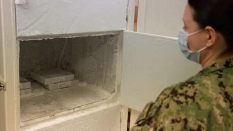 Lt. Jennifer M. White opens the freezer used to store the Pfizer vaccine at Naval Medical Center Portsmouth on March 15th.