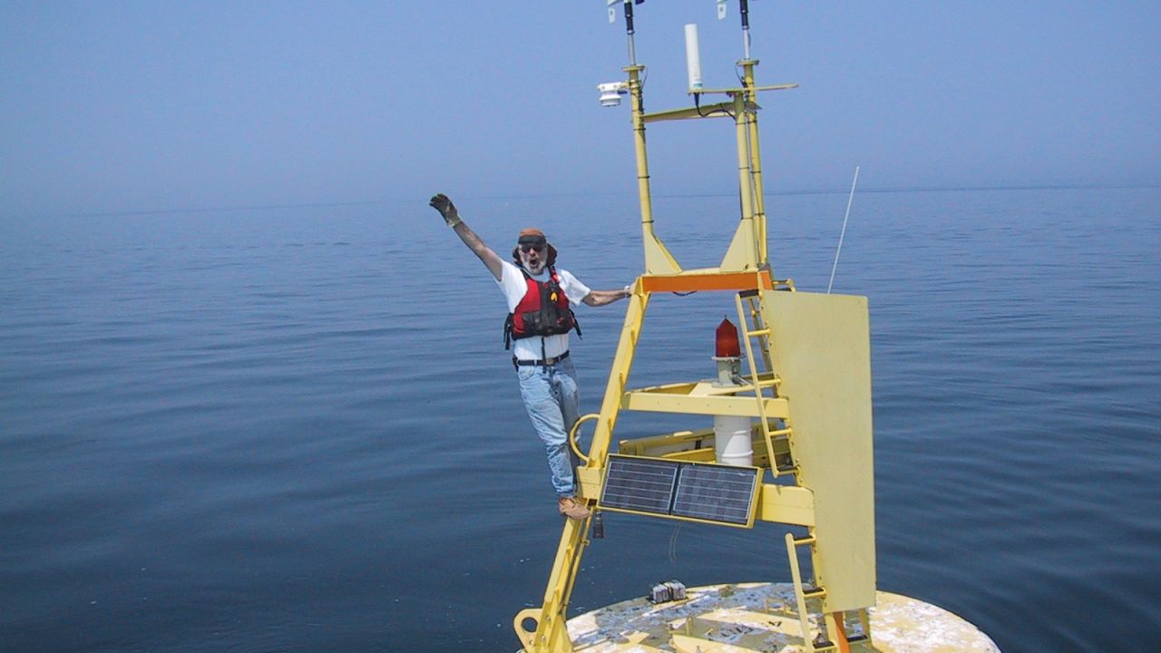 Mike McCormick, a co-author on the new study, stands on a buoy in Lake Michigan in 1999.