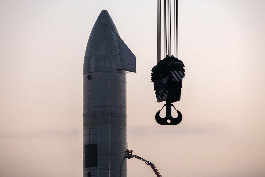 Crews work on the Starship SN11 prototype vehicle at the SpaceX launch site.