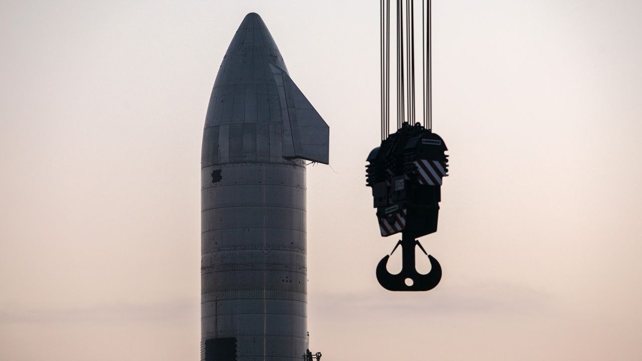 Crews work on the Starship SN11 prototype vehicle at the SpaceX launch site.