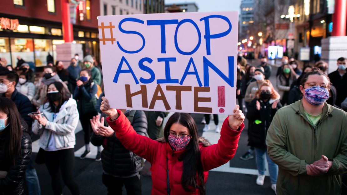 Protesters rally against Asian American discrimination and remember the lives lost in the Atlanta shootings, in Chinatown, Washington, DC, March 17. Six women of Asian heritage lost their lives.