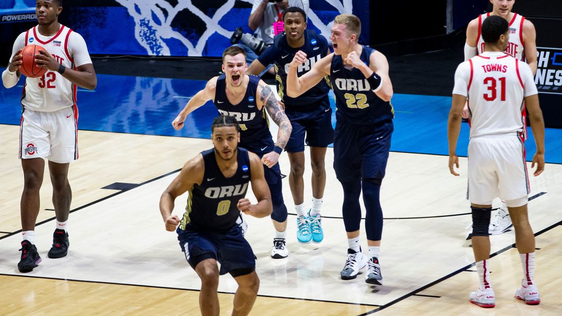 Players from Oral Roberts celebrate after their upset win over Ohio State on March 19. The Golden Eagles won 75-72 in overtime. It's only the ninth time in tournament history that a 15-seed has defeated a 2-seed.