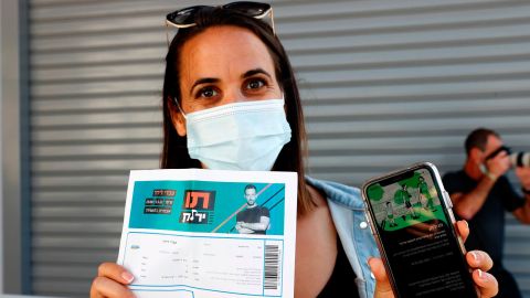 A concertgoer presents her "green pass" upon arrival at a Tel Aviv show.
