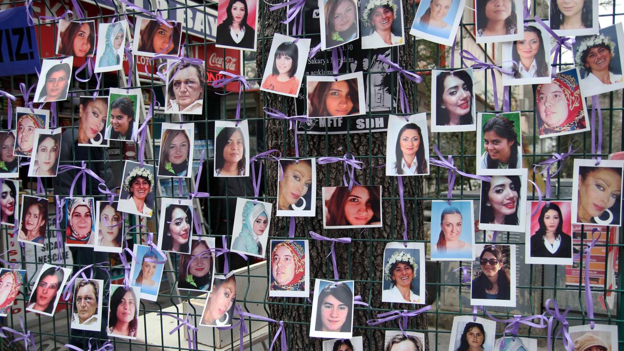 Pictures are displayed at a photo exhibition of murdered women staged as a protest  against violence towards women in Ankara on March 6, 2015 ahead of International Women's day on March 8, 2015. AFP PHOTO/ADEM ALTAN        (Photo credit should read ADEM ALTAN/AFP via Getty Images)