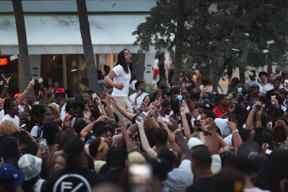 People enjoy themselves along Ocean Drive on March 19, 2021 in Miami Beach, Florida