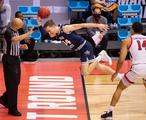 Utah State forward Justin Bean tries to save a ball from going out of bounds during a first-round game against Texas Tech.