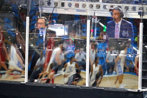 Television commentators Ian Eagle, left, and Grant Hill watch a game in West Lafayette, Indiana.