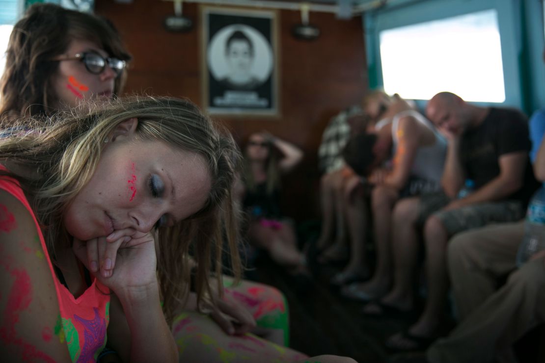 Exhausted partiers sleep on a ferry leaving Koh Phangan in 2013.