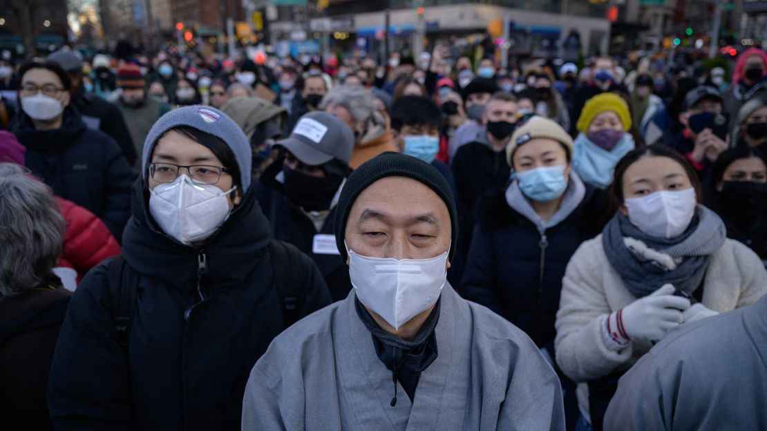 Members and supporters of the Asian American community gather in New York City's Union Square for a vigil on Friday, March 19.