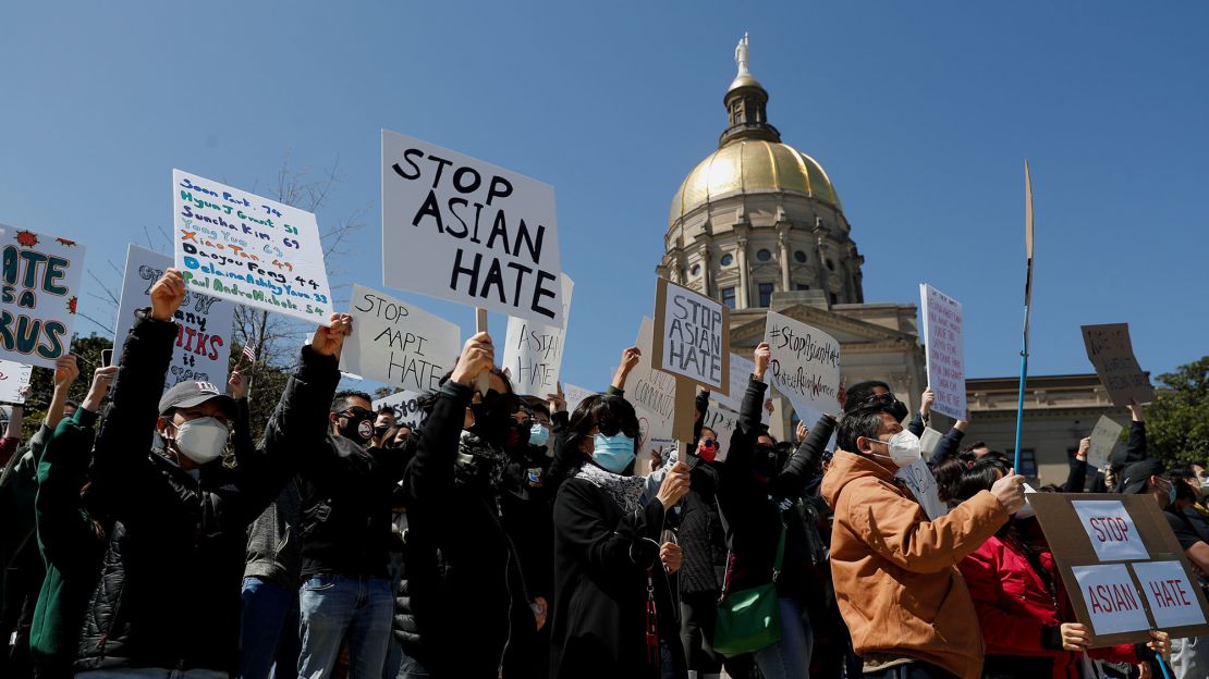 People attend a "Stop Asian Hate" rally next to the Georgia Capitol in Atlanta on Saturday, March 20.