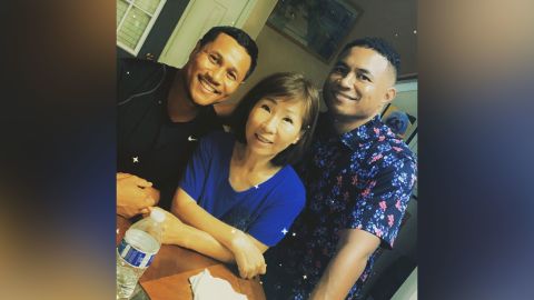 Yong Ae Yue, center, was one of the eight people killed in the Atlanta spa shootings and is remembered by her sons Elliott Peterson, left, and Robert Peterson, right.
