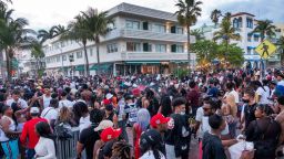 Mandatory Credit: Photo by CRISTOBAL HERRERA-ULASHKEVICH/EPA-EFE/Shutterstock (11823869f)A large crowd of people participate in a party on a walkway near the beach, during spring break in Miami Beach, Florida, USA, 20 March 2021. Starting Saturday night, the city of Miami Beach is imposing a curfew for its entertainment district and also close the three causeways heading into the beach. The measures are being put into place as an effort to control large crowds that have gathered during spring break.Miami Beach to impose spring break curfew to curtail crowds as pandemic continues, USA - 20 Mar 2021