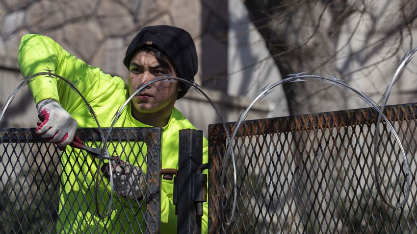 WASHINGTON, DC - MARCH 20: A worker removes the razor wire from the security fencing around the U.S. Capitol on March 20, 2021 in Washington, DC. The fencing was put in place after the January 6 attack on the Capitol building.  (Photo by Tasos Katopodis/Getty Images)