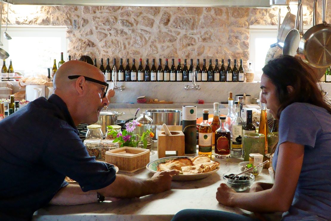 Stanley Tucci speaks with winemaker Arianna Occhipinti at her vineyard in Vittoria, Sicily.