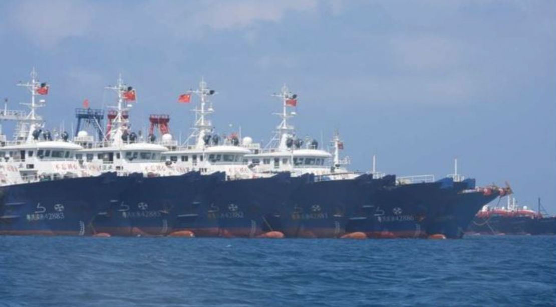 In this March 7, 2021, photo provided by the Philippine Coast Guard/National Task Force-West Philippine Sea, some of the 220 Chinese vessels are seen moored at Whitsun Reef, South China Sea. 