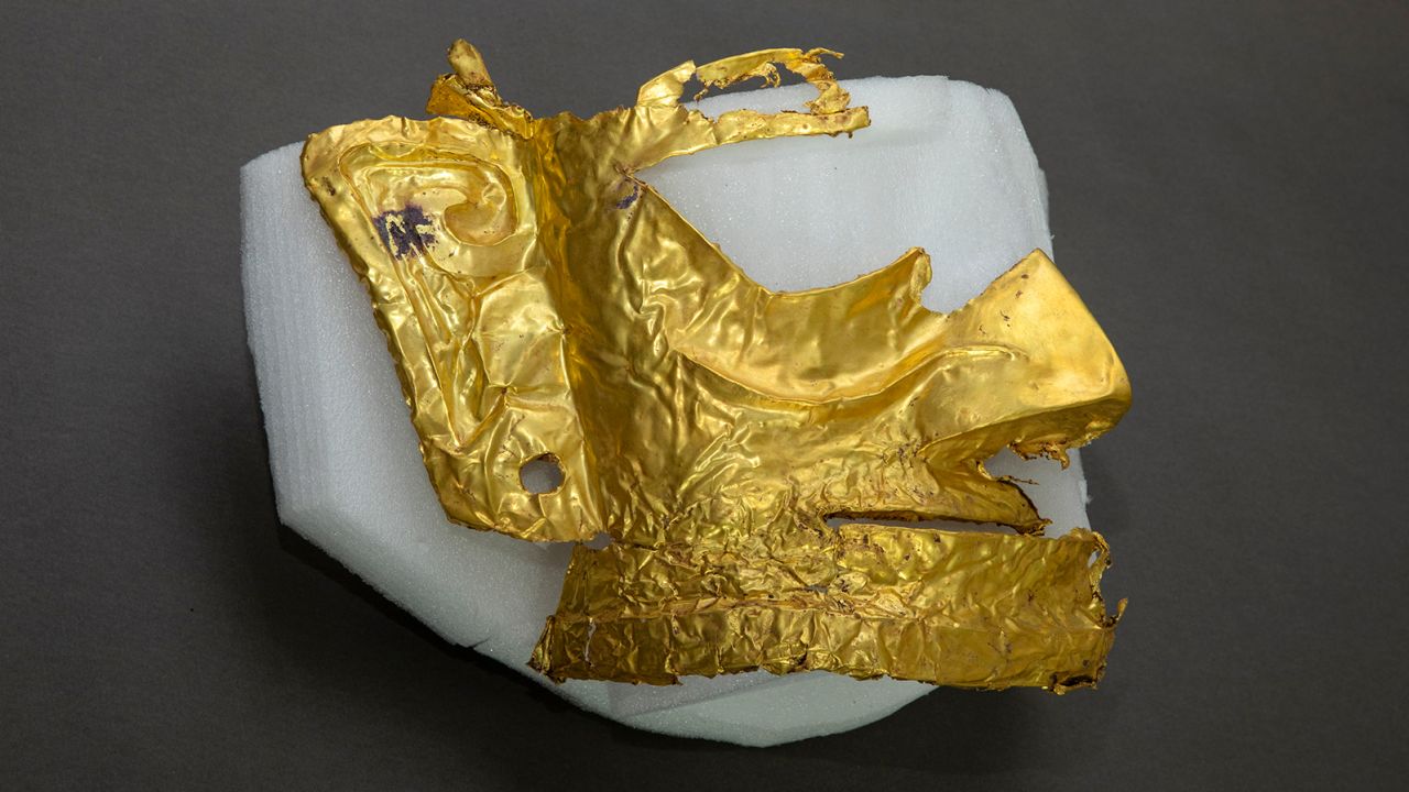 (210320) -- CHENGDU, March 20, 2021 (Xinhua) -- Photo taken on March 17, 2021 shows a broken gold mask unearthed from a sacrificial pit at the Sanxingdui Ruins site in southwest China's Sichuan Province.
  Chinese archaeologists announced Saturday that some new major discoveries have been made at the legendary Sanxingdui Ruins site in southwest China, helping shed light on the cultural origins of the Chinese nation.
  Archaeologists have found six new sacrificial pits and unearthed more than 500 items dating back about 3,000 years at the Sanxingdui Ruins in Sichuan Province, the National Cultural Heritage Administration announced in the provincial capital Chengdu. (Xinhua/Shen Bohan) (Photo by Xinhua/Sipa USA)