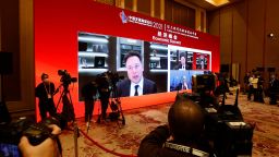 BEIJING, CHINA - MARCH 20: A screen shows Tesla CEO Elon Mask speaking via video link during the 2021 China Development Forum at Diaoyutai State Guesthouse on March 20, 2021 in Beijing, China. (Photo by Han Haidan/China News Service via Getty Images)