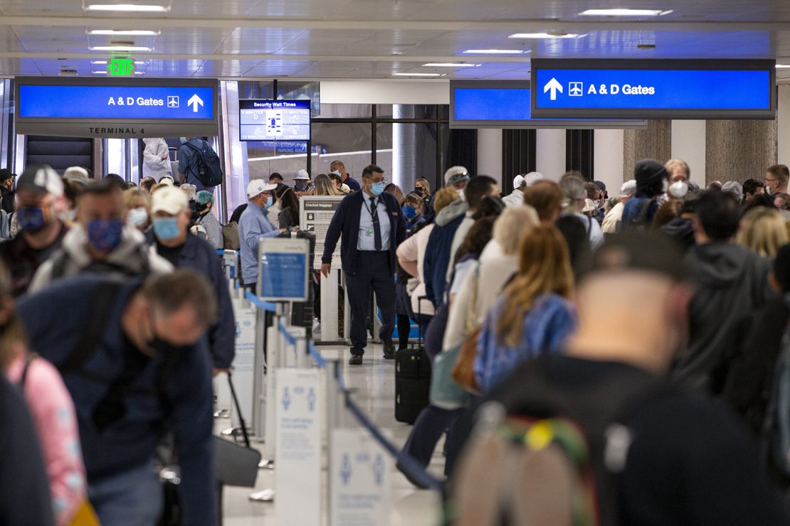 Travelers wait in line at ticketing in Sky Harbor International Airport in Phoenix, Arizona, on March 11.