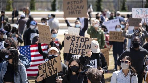 Demonstrators hold signs at a Stop AAPI Hate Rally outside the Georgia Capitol building in Atlanta on Saturday, March 20.
