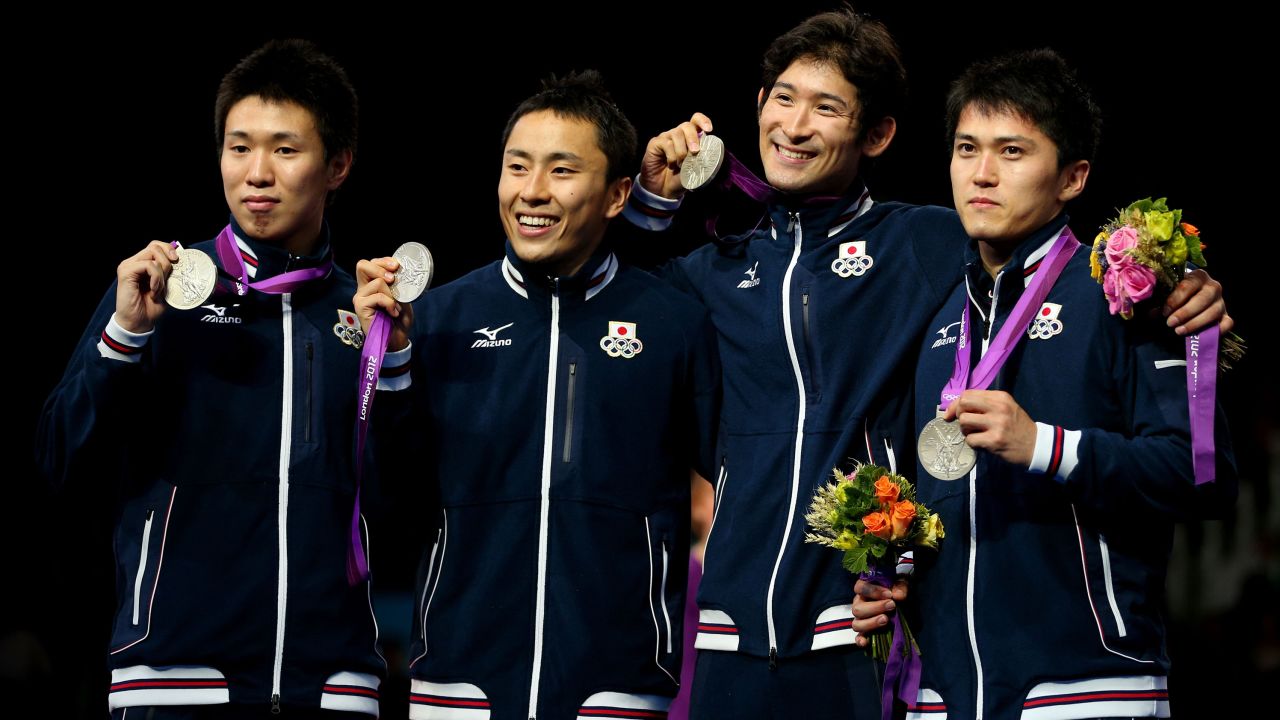 Miyake celebrates with his team after winning a silver medal at London 2012.