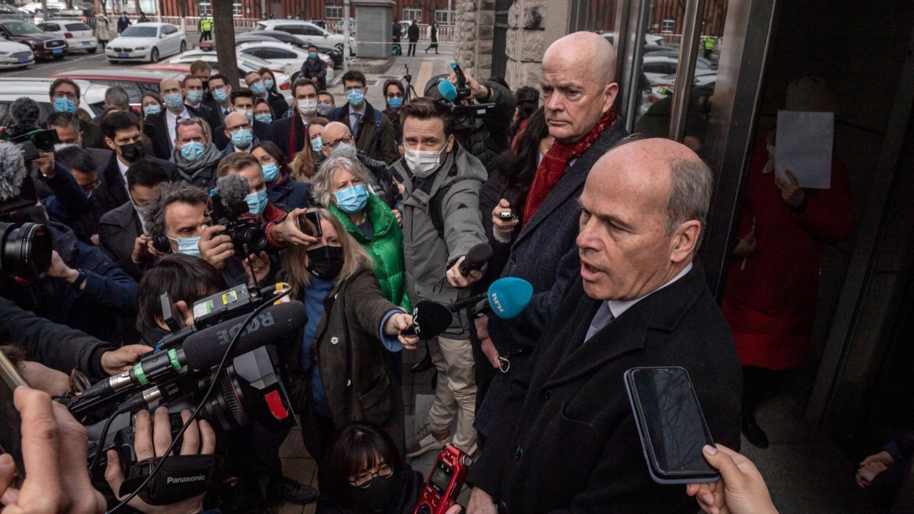 Jim Nickel (front R), charge d'affaires of the Canadian embassy in Beijing, speaks to the media outside the Beijing No. 2 Intermediate Court on March 22, 2021.