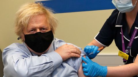 Boris Johnson receives his first dose of a AstraZeneca/Oxford Covid-19 vaccine at St. Thomas' Hospital in London on March 19, 2021. 