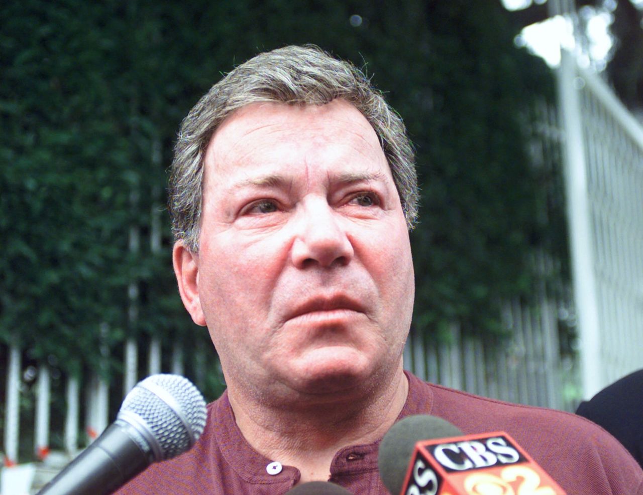 Shatner speaks to reporters after the death of his third wife, Nerine Kidd, in 1990. Shatner found her body after she had drowned in their swimming pool.
