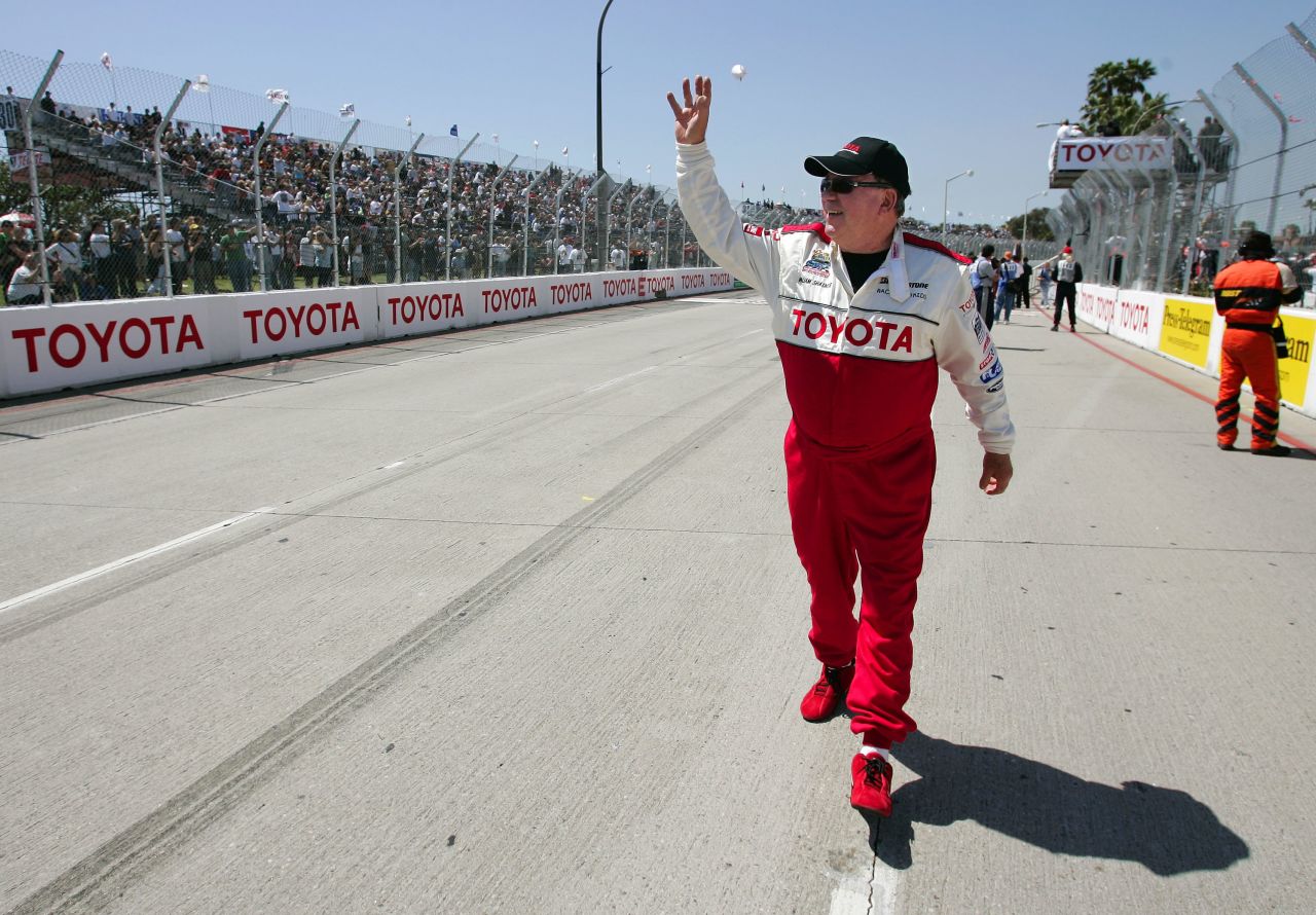 Shatner waves to the crowd prior to a celebrity race at the Grand Prix of Long Beach in 2006.