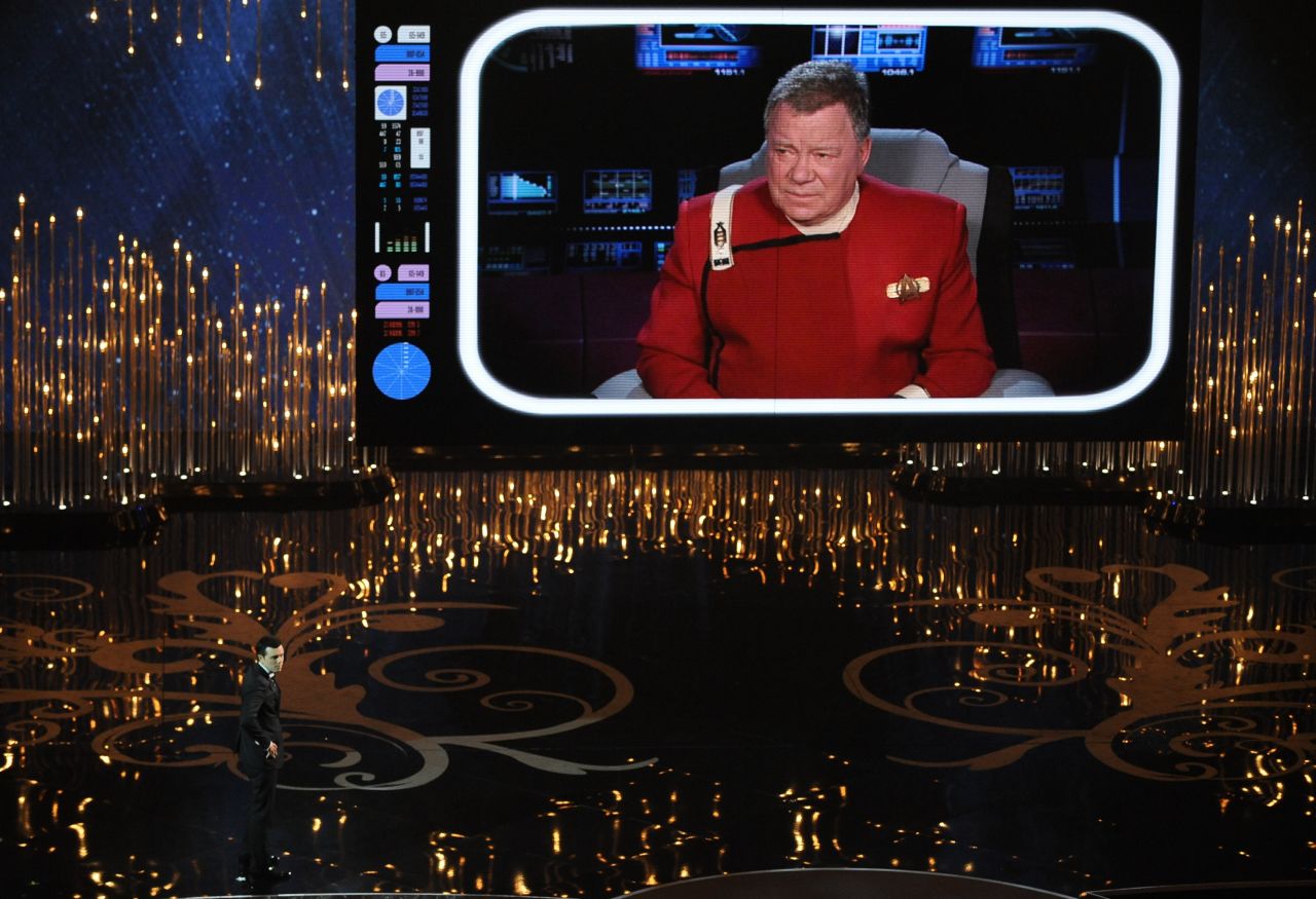 Shatner interacts with host Seth MacFarlane during the Academy Awards show in 2013.