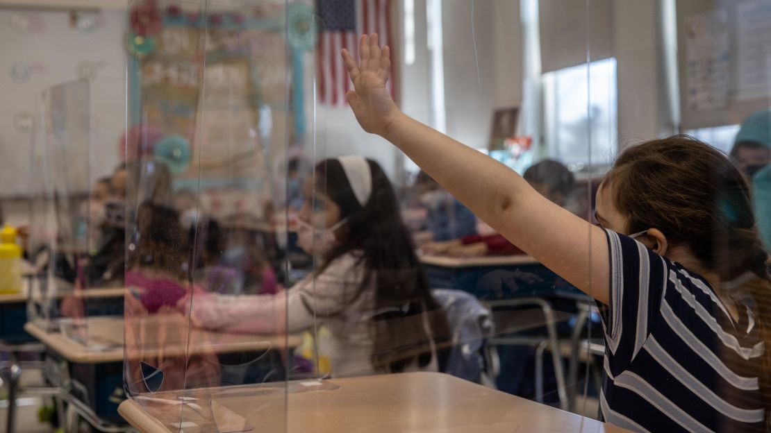 Students take part in class on the first day of in-person learning five days per week at Stark Elementary School, in Stamford, Connecticut, March 10. Many districts nationwide are returning to full-time in-school instruction as pandemic restrictions ease.