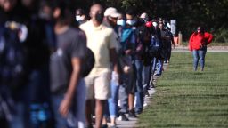 In this October 30, 2020, file photo, people line up to vote at the Gwinnett County Fairgrounds in Lawrenceville, Georgia. Hundreds of people lined up for about an hour on the final day of early voting in the state. 