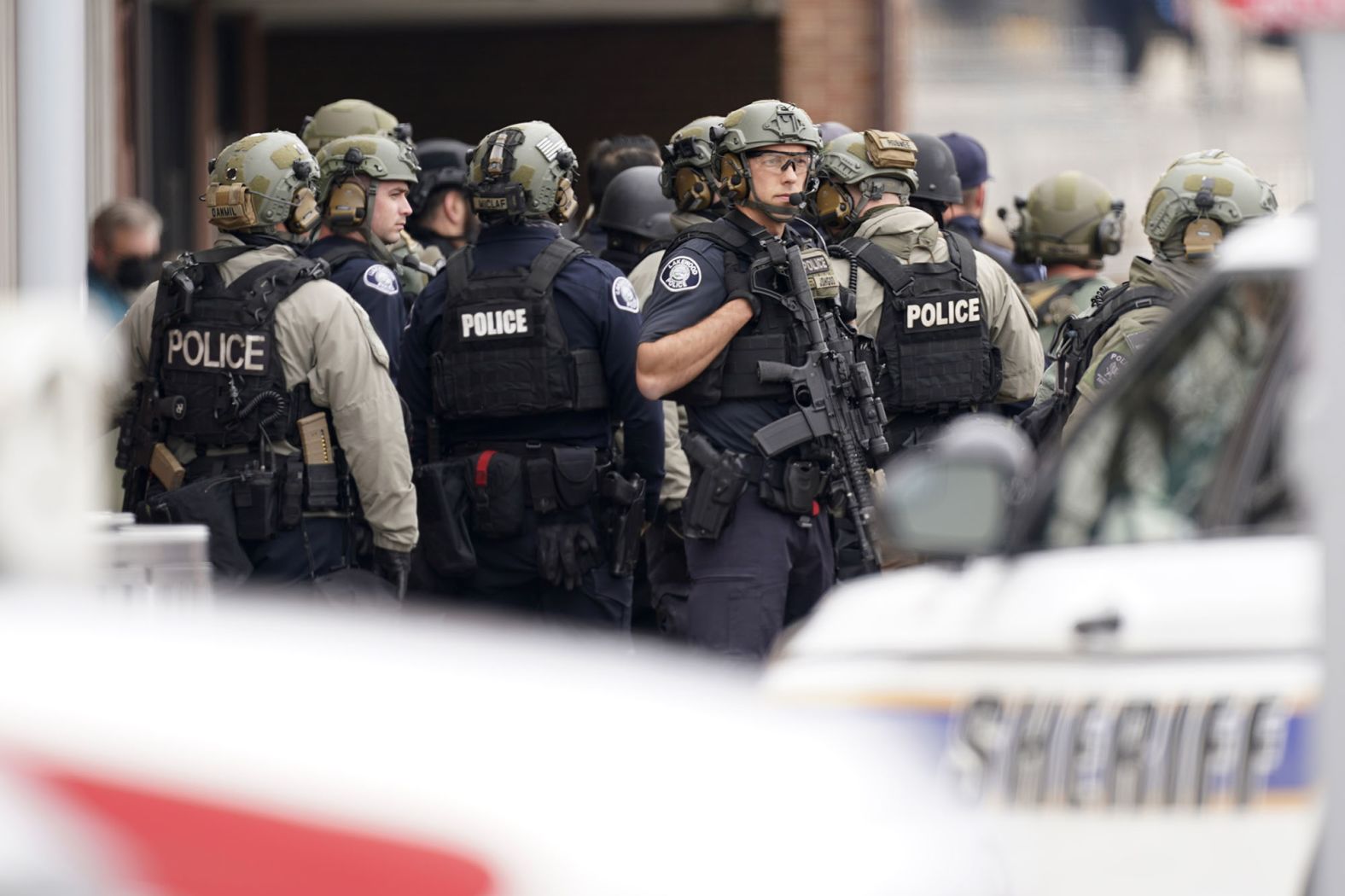 Police gather at the scene.